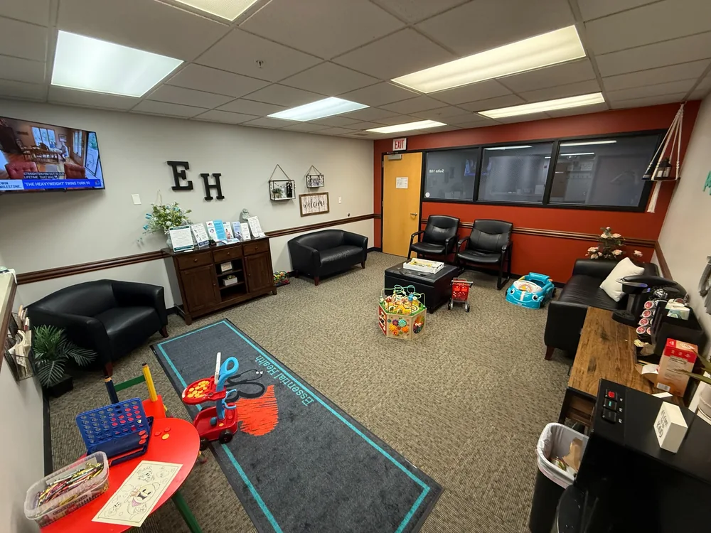 Essential Health’s welcoming Davenport office with comfortable seating and a coffee station